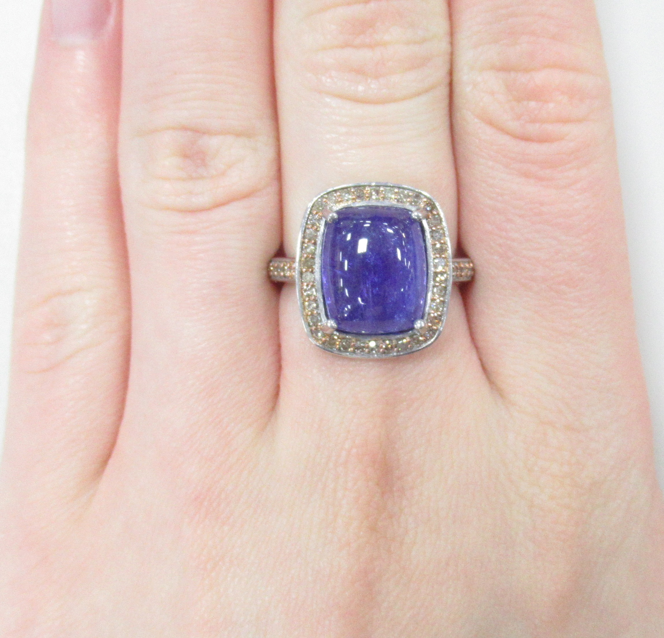 Серебряное кольцо 925 пробы; с эл. золочения; вставки 1 Танзанит 8,18ct; 48 Бр.коньяч.Кр-17 0,41ct 4/4;